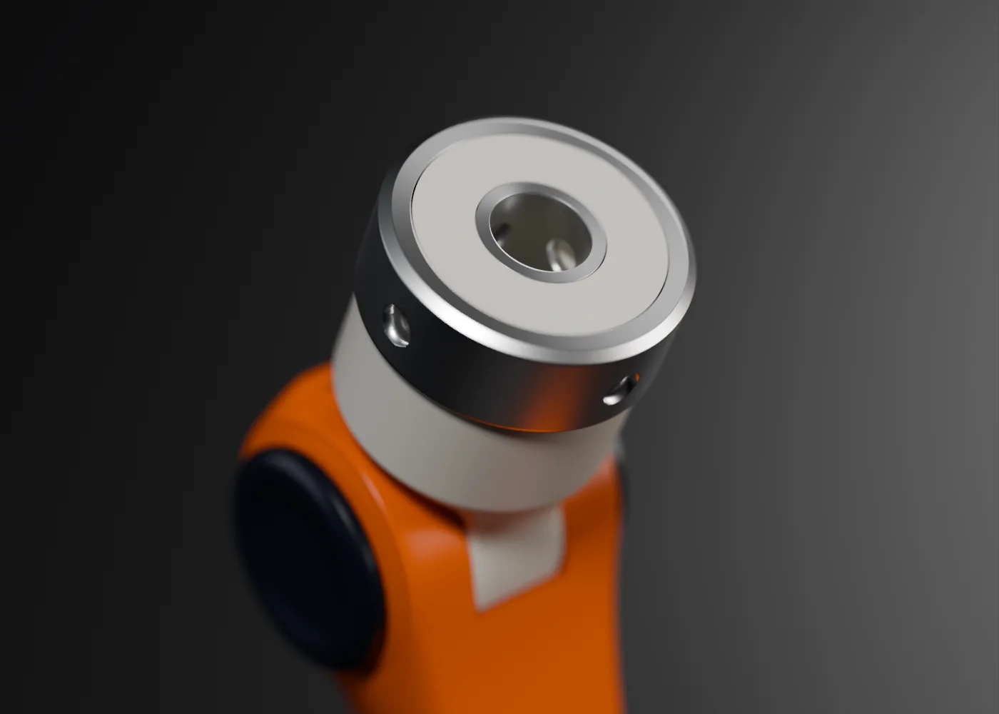 Close-up of the upper interface with the external steel bushing around its neck, the internal bushing in the channel and the radial screw holes.